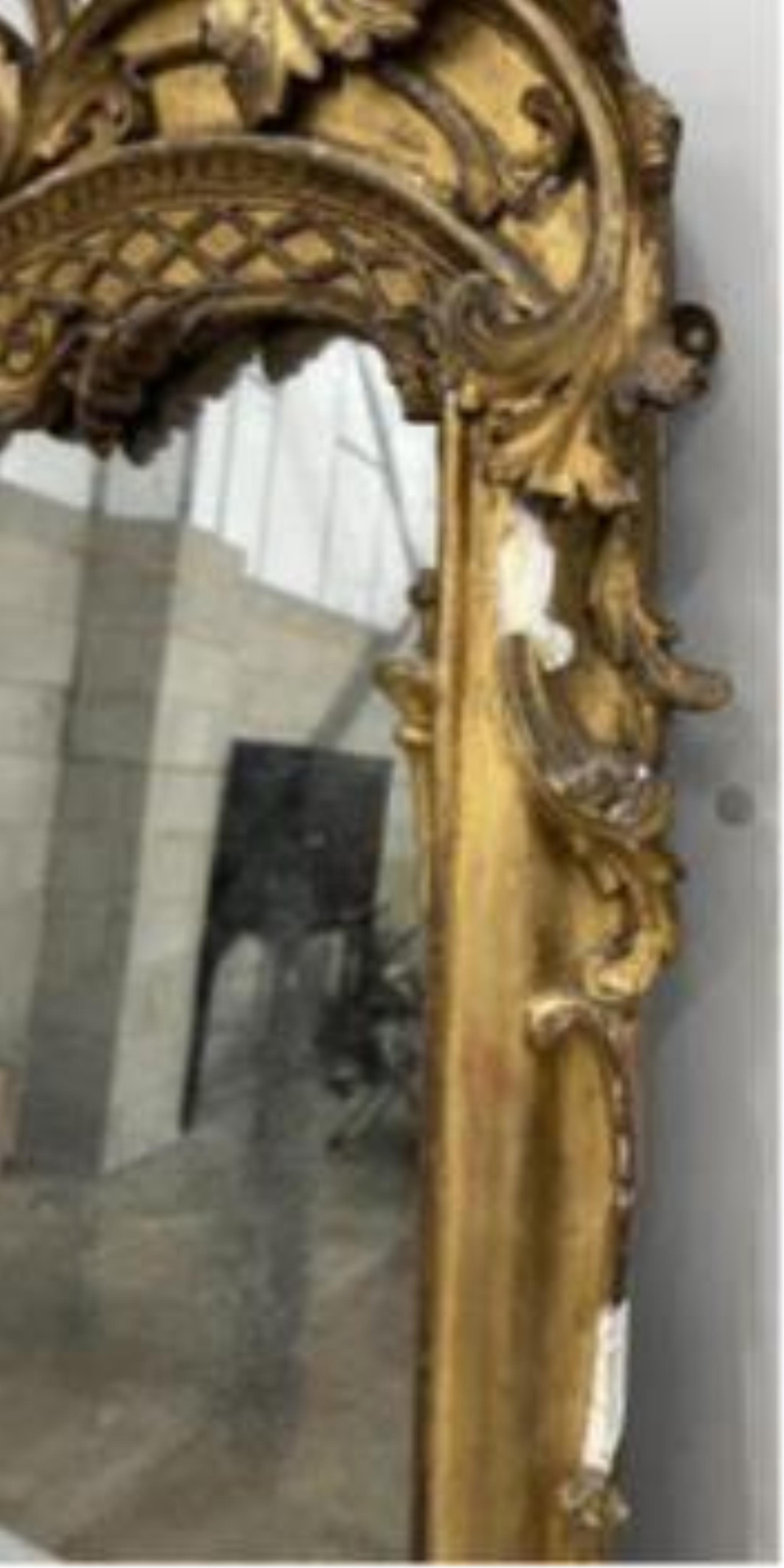 A Victorian carved giltwood and composition marble topped serpentine console table and mirror, width 132cm, height 177cm.